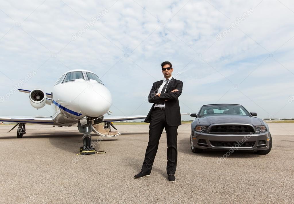 depositphotos_40073085-stock-photo-businessman-standing-by-car-and.jpg